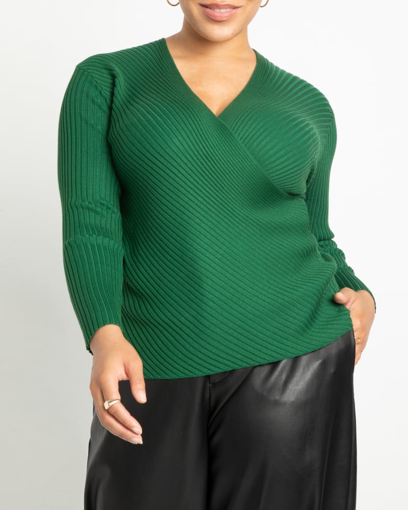 Front of a model wearing a size 14/16 Kennedy Ribbed Wrap Sweater in Eden by ELOQUII. | dia_product_style_image_id:242091